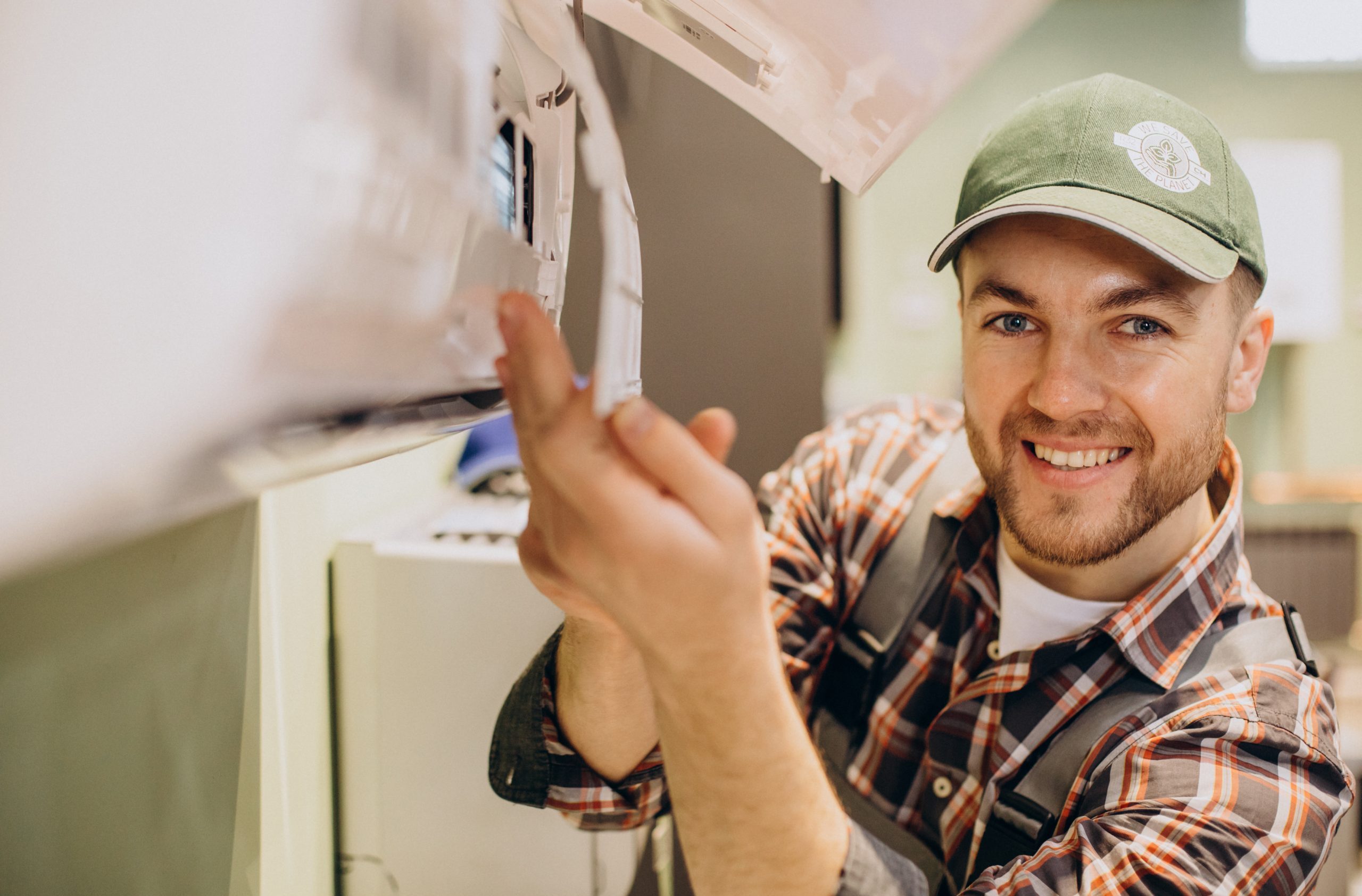 repairman doing air conditioner service scaled e1742731741383