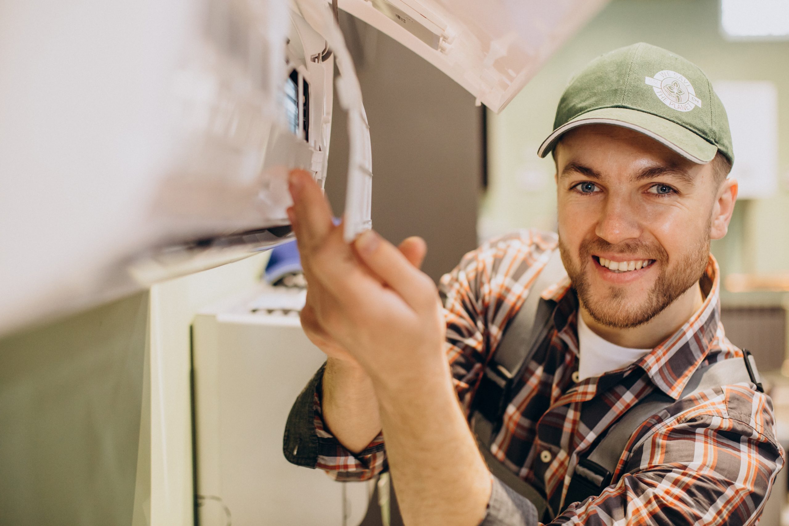 repairman doing air conditioner service scaled